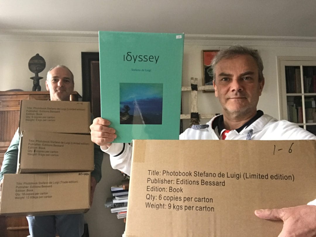 Finally #Idssey has arrived after a long trip on boat, Stefano De Luigi and Pierre Bessard the warehousemen, workmen of the book, discharge the boxes 12,6 kg (trade edition) & 9 kg (artist edition) each, a limited edition of 500 copies, all photobooks arrived by plane was sold out, it was time that they arrive. Editions Bessard available on our website Now! with a signed c print…
